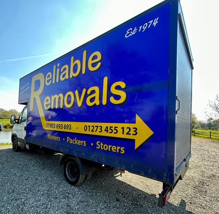 Reliable Removals Luton van, established 1974, showing the Worthing landline 01903 693 693