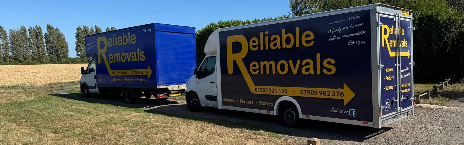 Two Reliable Removals vans parked on a job in the Sussex countryside